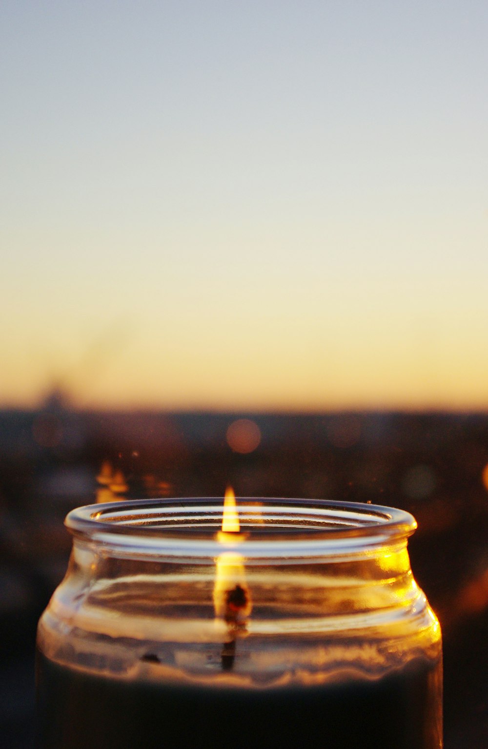 a close up of a candle on a table