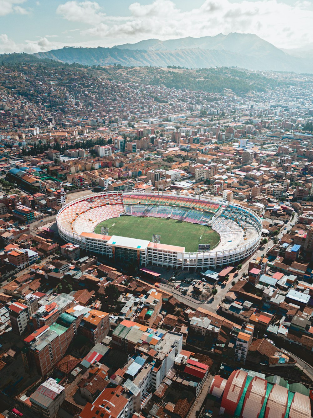 an aerial view of a soccer stadium in a city