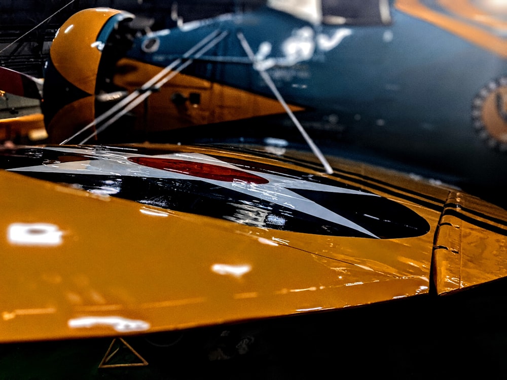 a close up of a yellow and black airplane