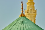 a large green dome with a gold top