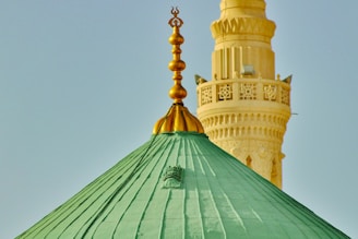 a large green dome with a gold top