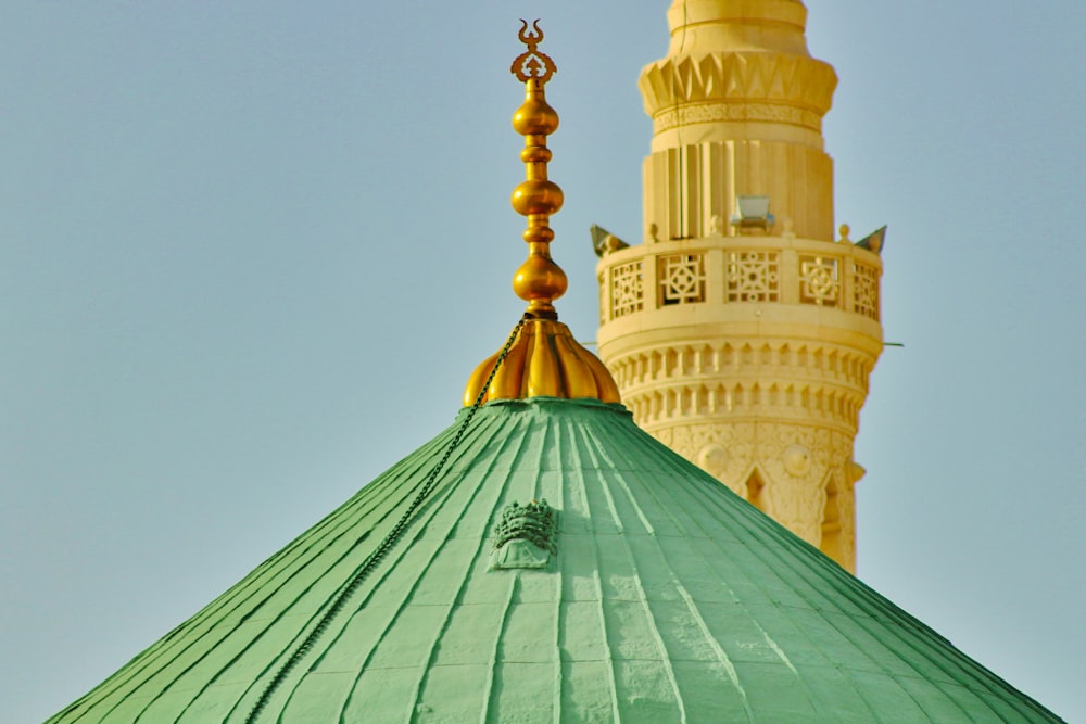 a large green dome with a gold top
