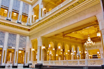 the inside of a large building with chandeliers