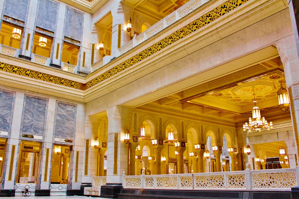 the inside of a large building with chandeliers