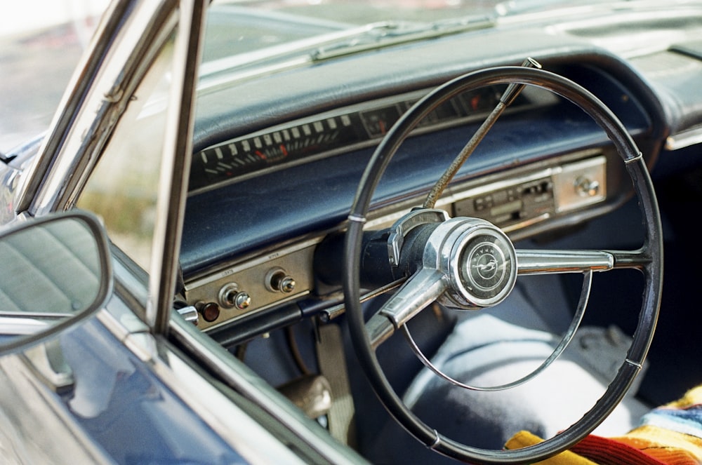 a close up of a car dashboard with a steering wheel