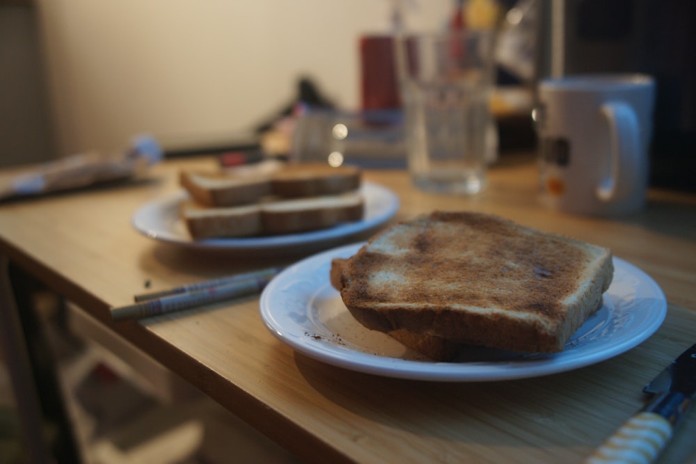 a couple of pieces of toast on a white plate