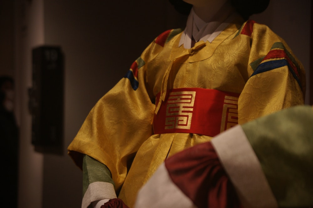 a mannequin dressed in a traditional chinese costume