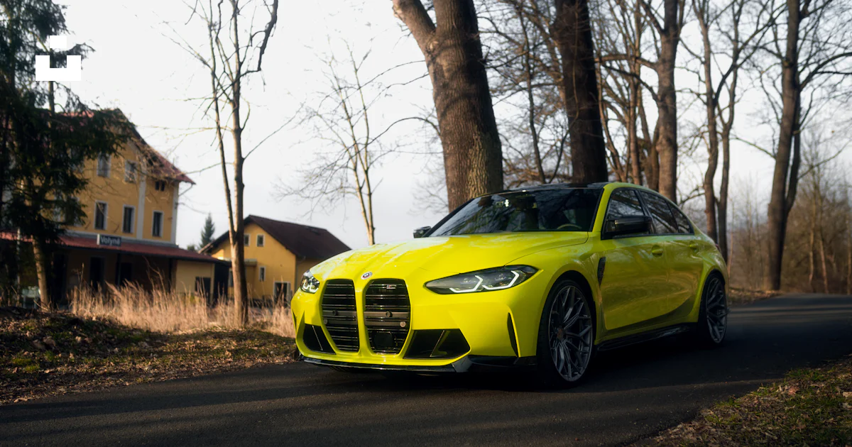 A yellow sports car driving down the road photo – Free Volyně Image on ...