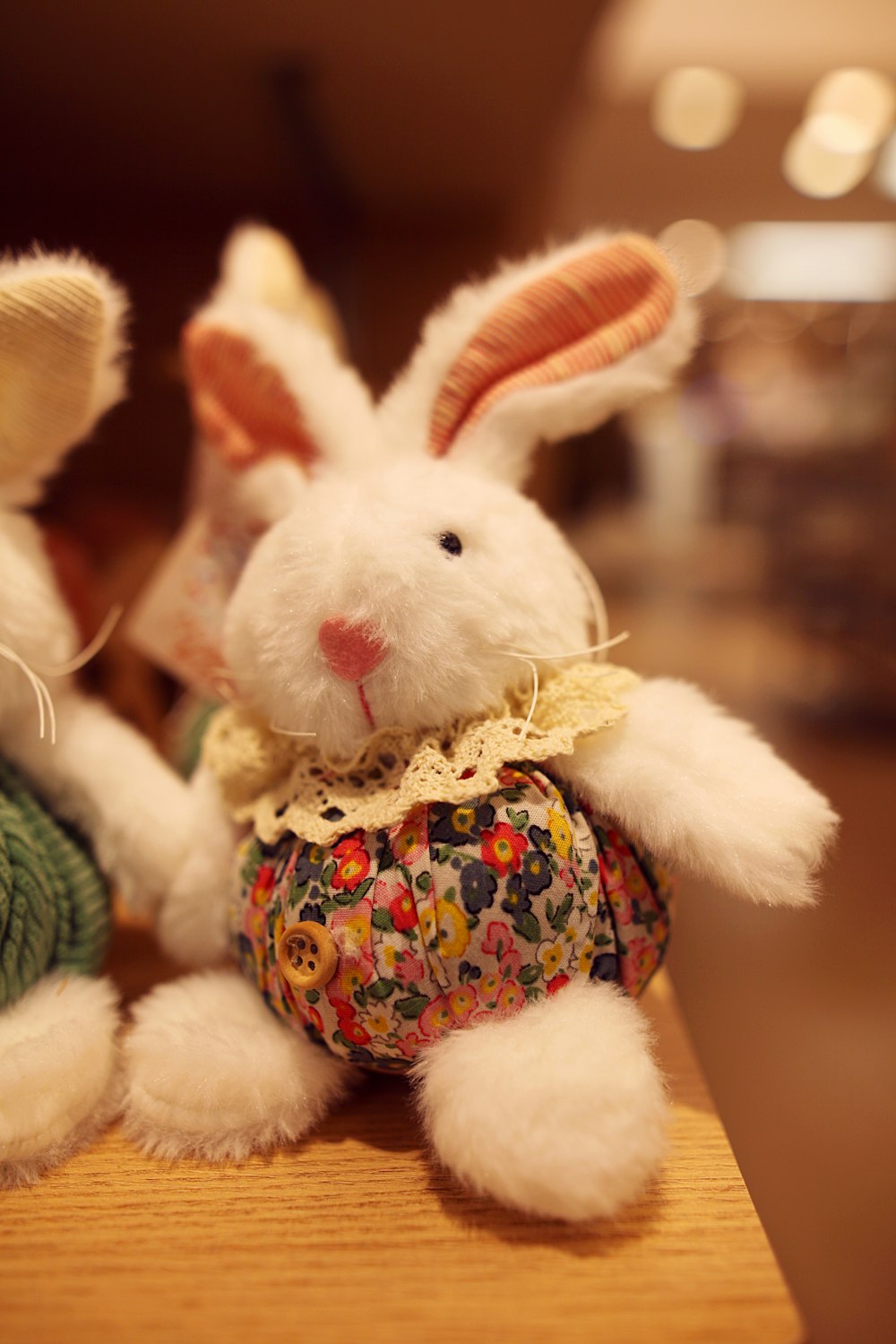 a couple of stuffed animals sitting on top of a table