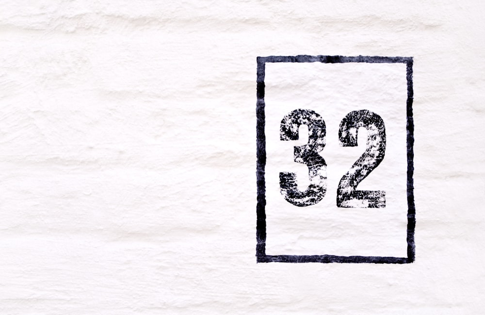 a drawing of the number twenty two on a white wall
