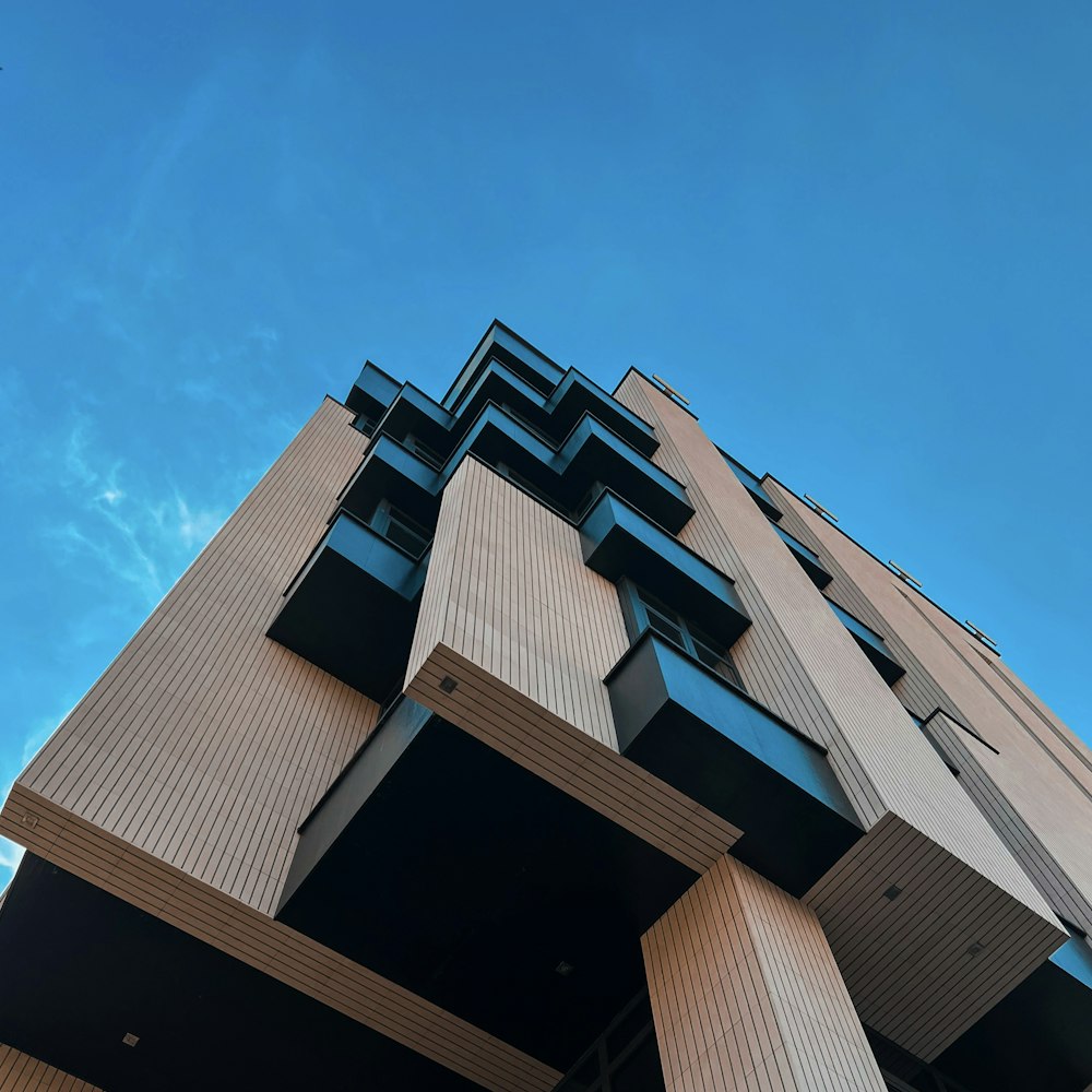 a tall building with lots of windows and balconies