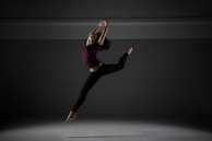 A dynamic leap frozen in mid-air, highlighting the athleticism and grace of the performers.