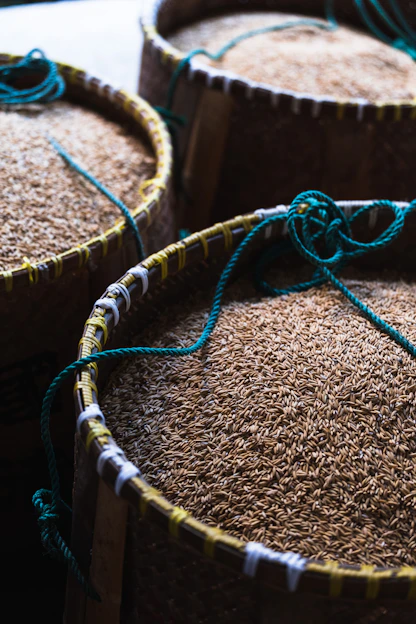 a close up of three baskets filled with rice