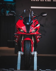 A vibrant red motorcycle on display.