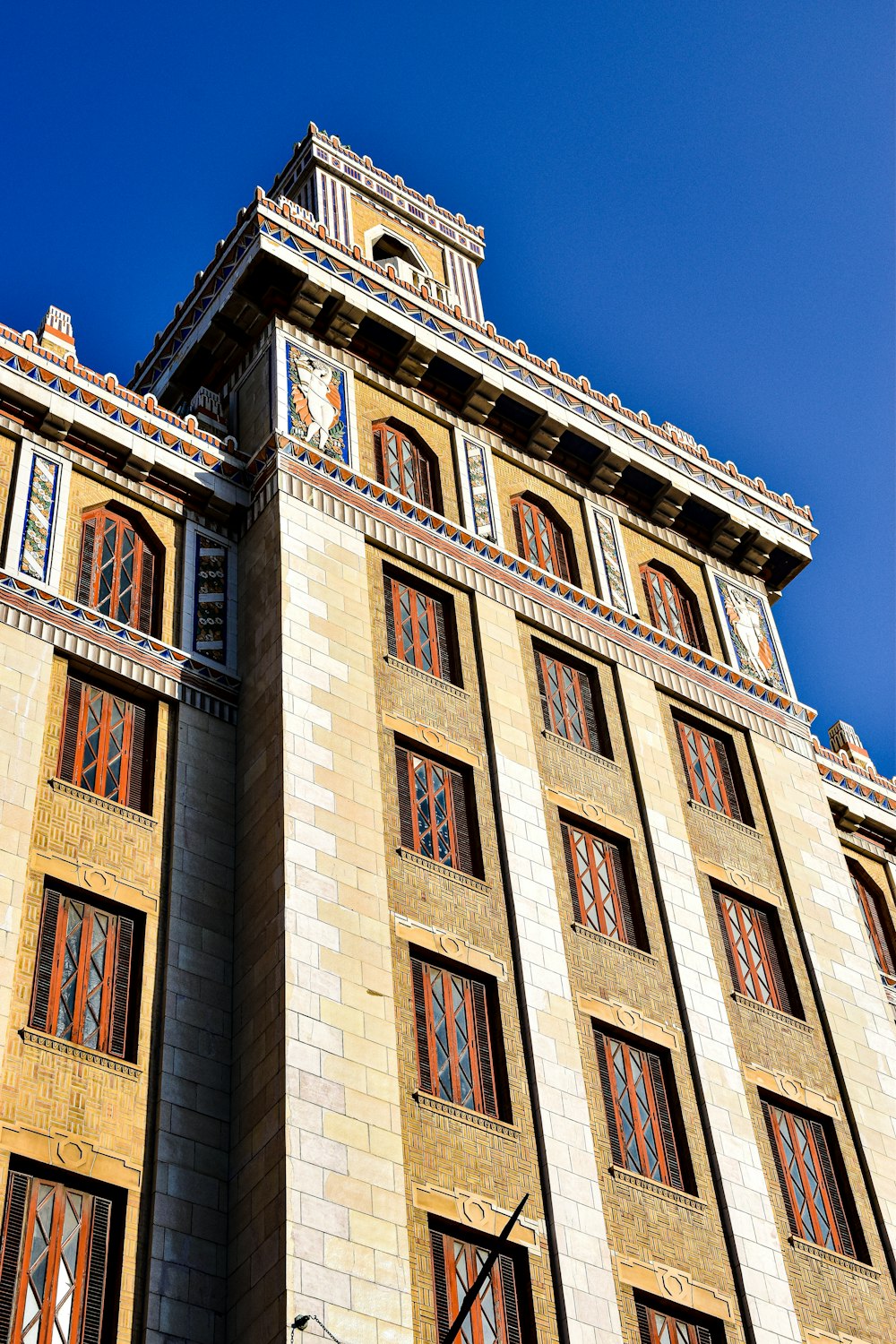 a tall building with a clock on the side of it