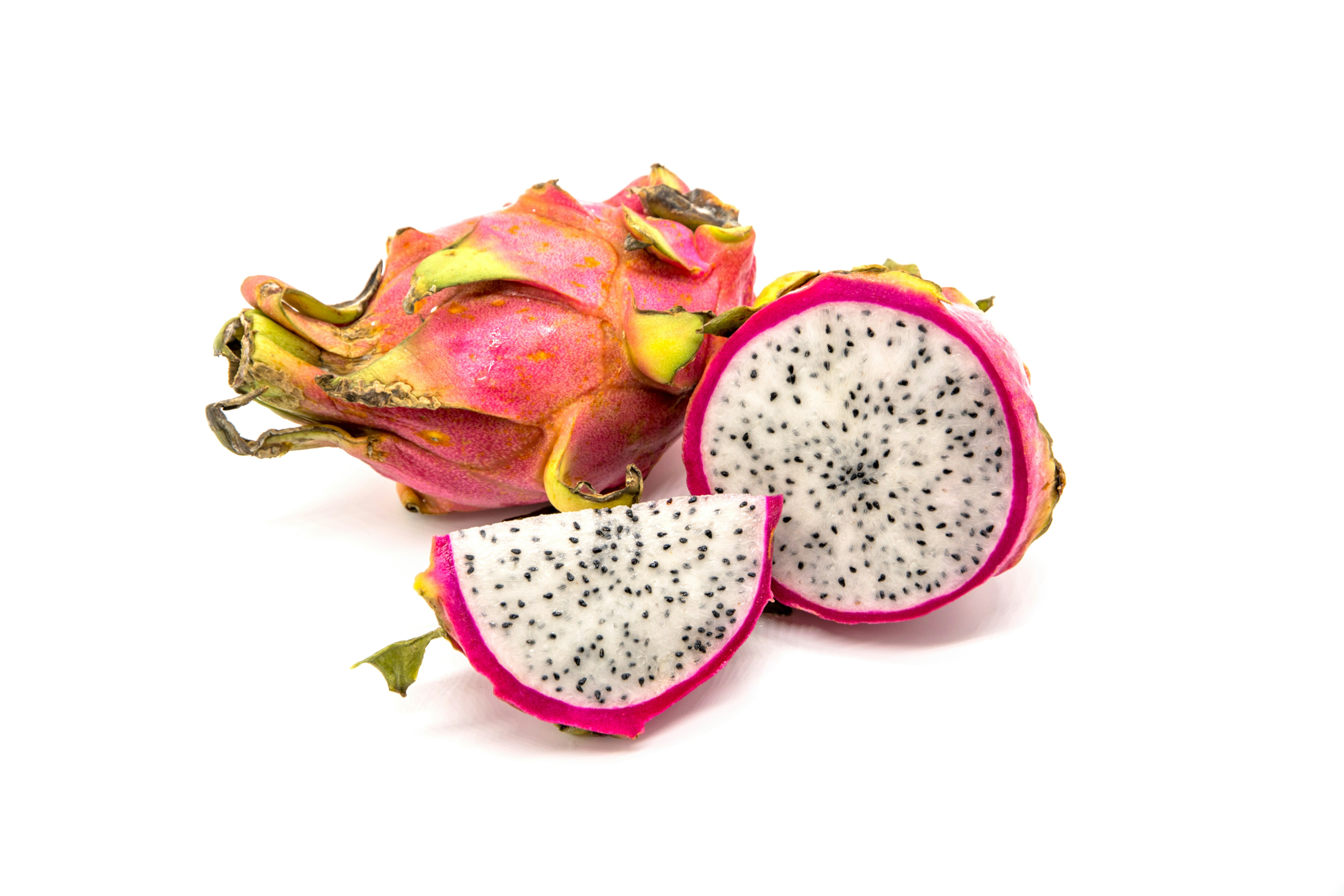 a dragon fruit cut in half on a white background, Fresh dragon fruit isolated on white background