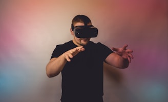 a man in a black shirt is using a virtual device