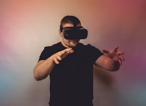 a man in a black shirt is using a virtual device