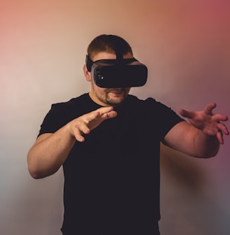 a man in a black shirt is using a virtual device