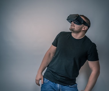a man wearing a black t - shirt and a pair of virtual glasses