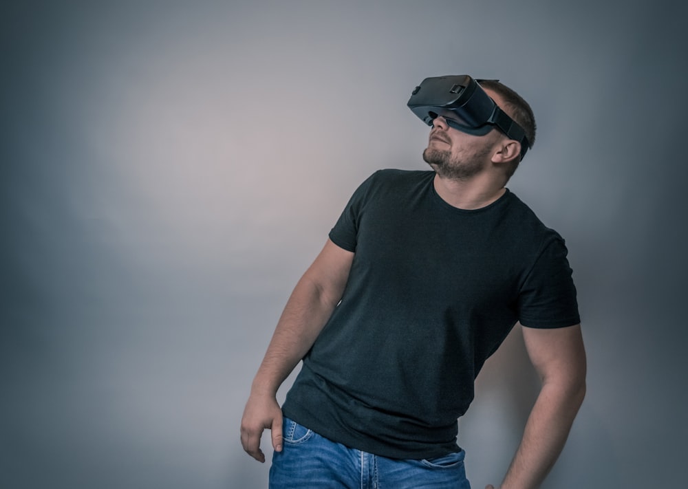 a man wearing a black t - shirt and a pair of virtual glasses