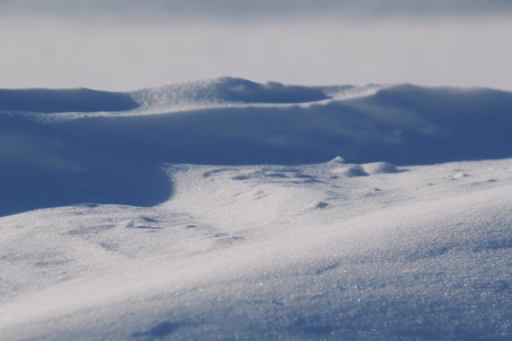 a view of a snow covered hill from the top of a hill