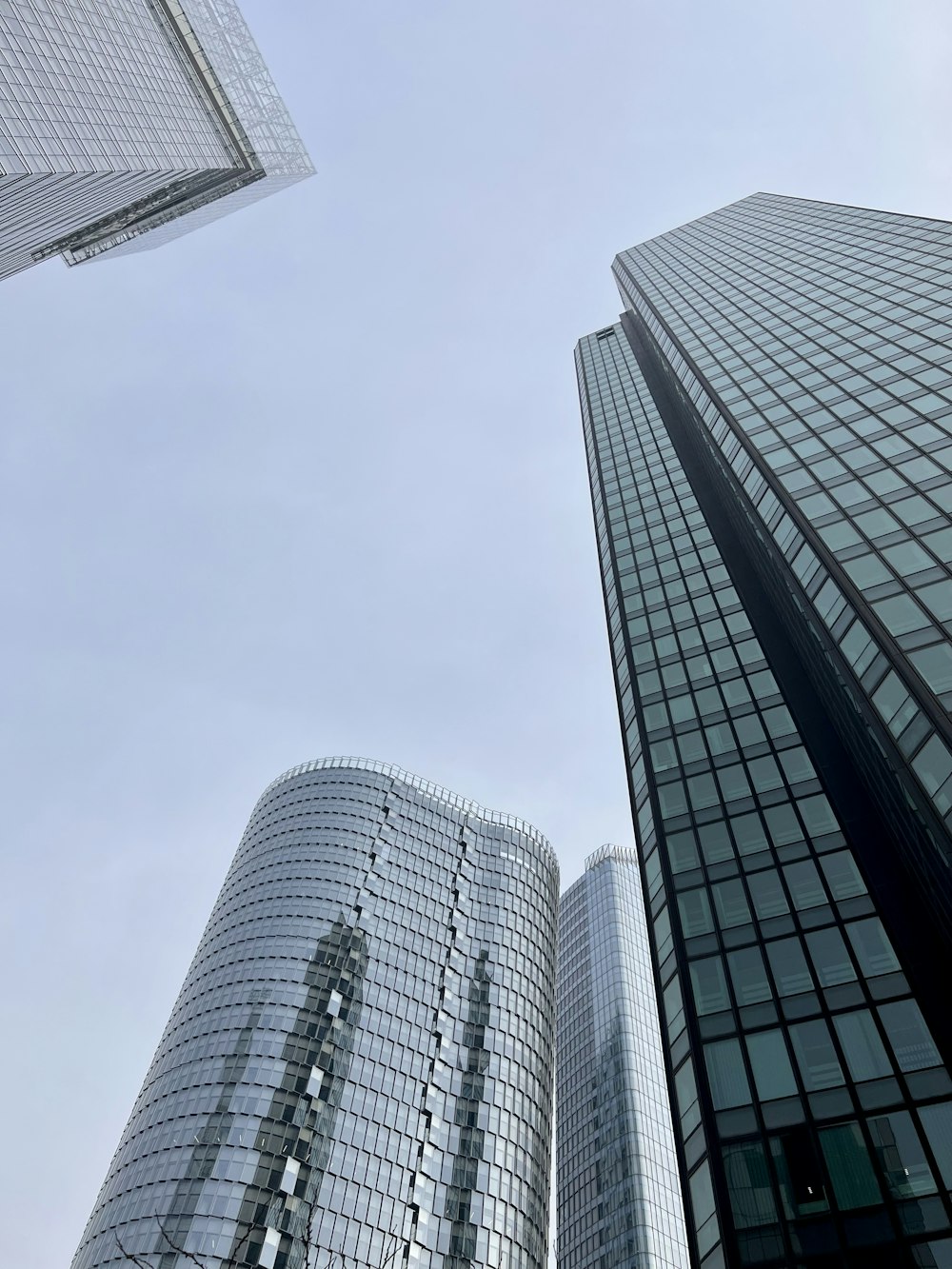 a couple of tall buildings sitting next to each other