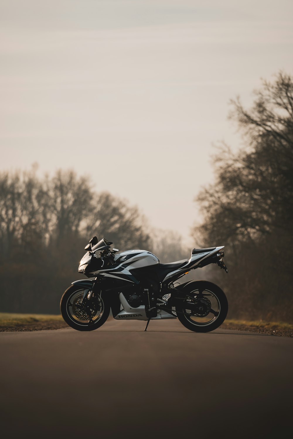 a motorcycle parked on the side of a road