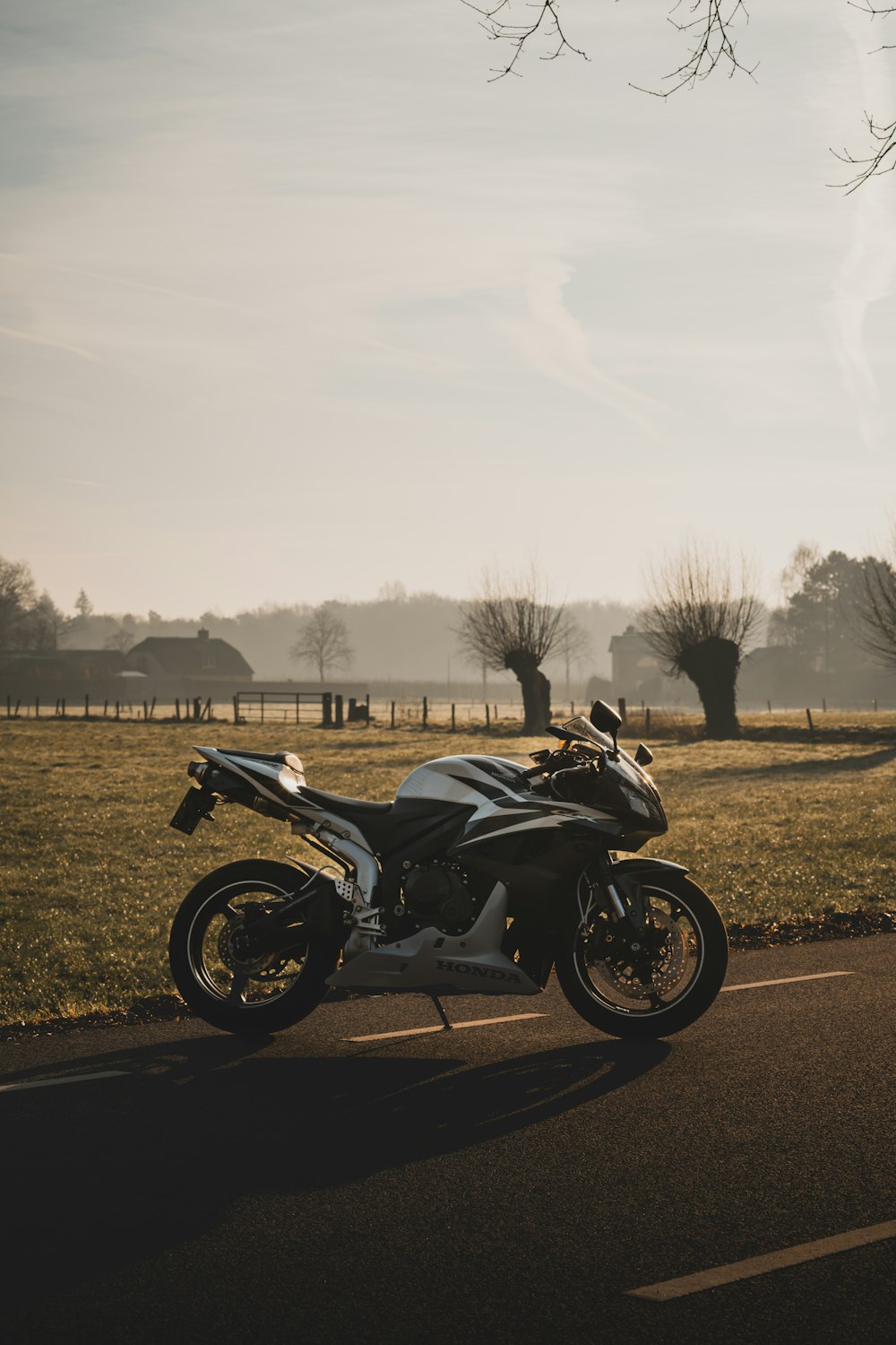 a motorcycle parked on the side of a road