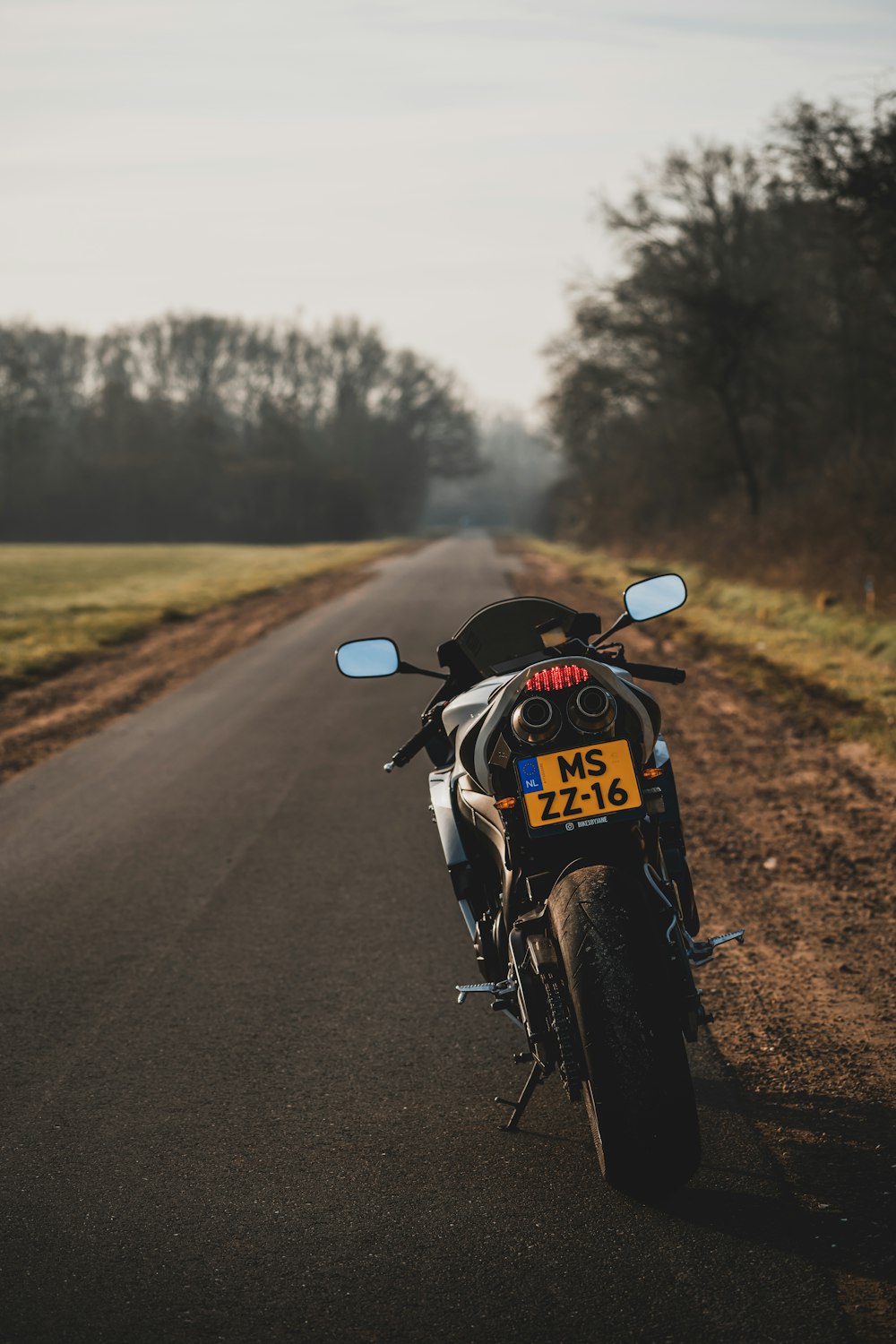 a motorcycle parked on the side of the road