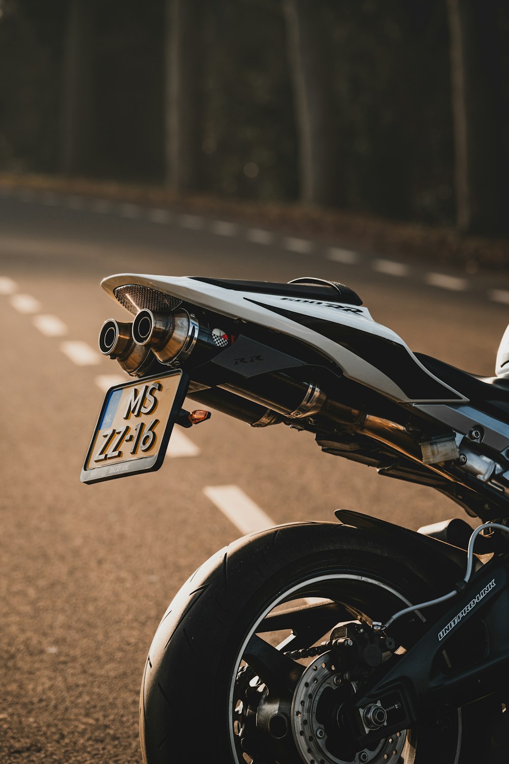 a motorcycle parked on the side of the road