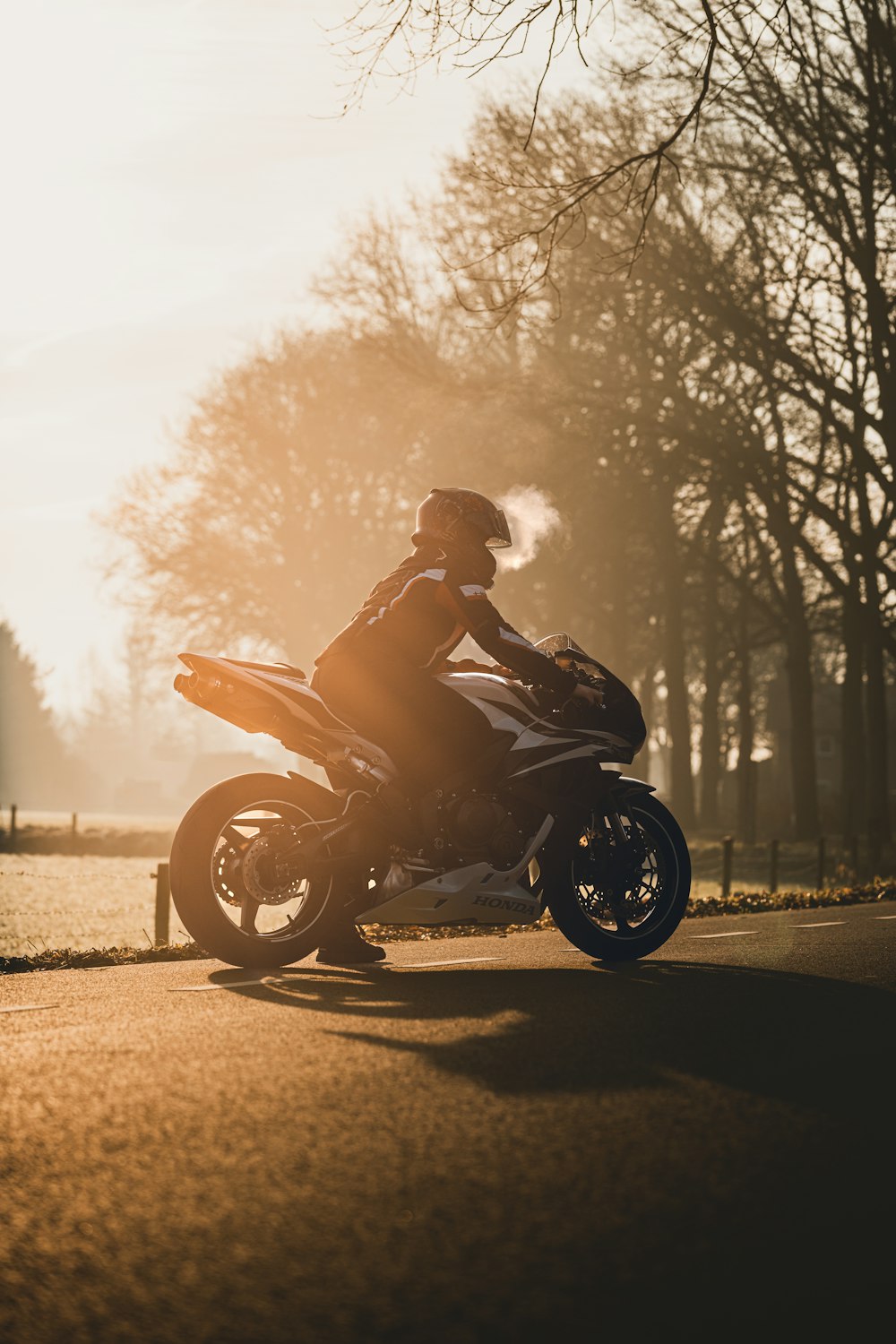 a person riding a motorcycle on a road