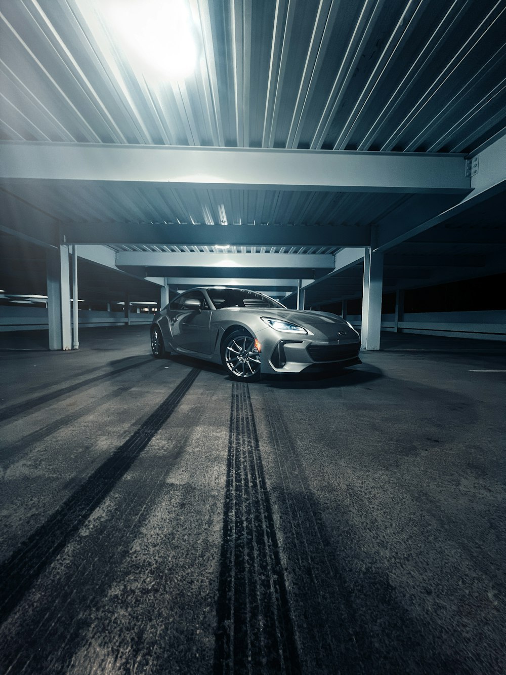 a sports car parked in a parking garage