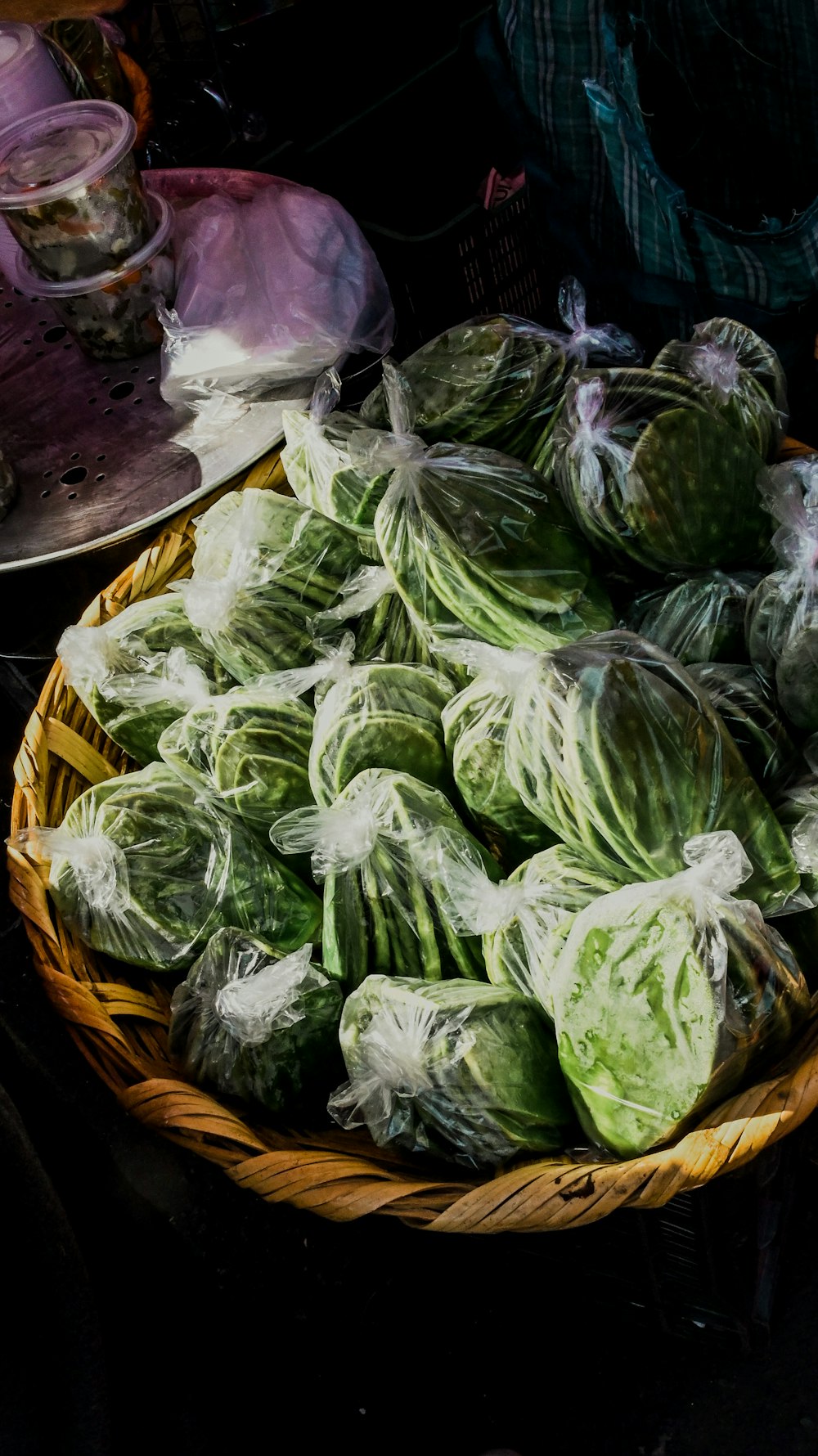 a basket filled with cabbage sitting on top of a table