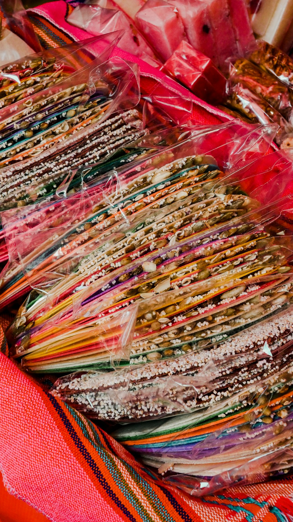 a pile of different colored papers sitting on top of a table