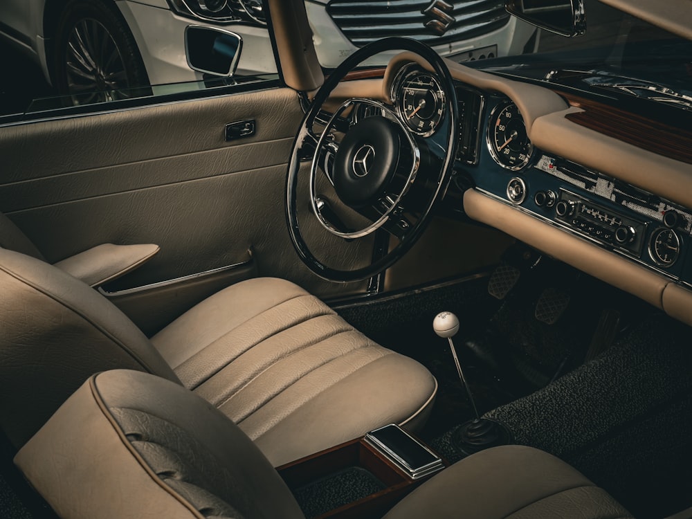 the interior of a car with a steering wheel and dashboard