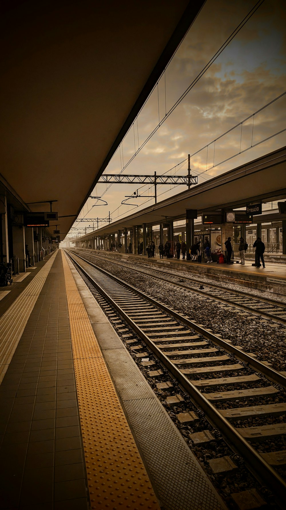 a train station with a train on the tracks