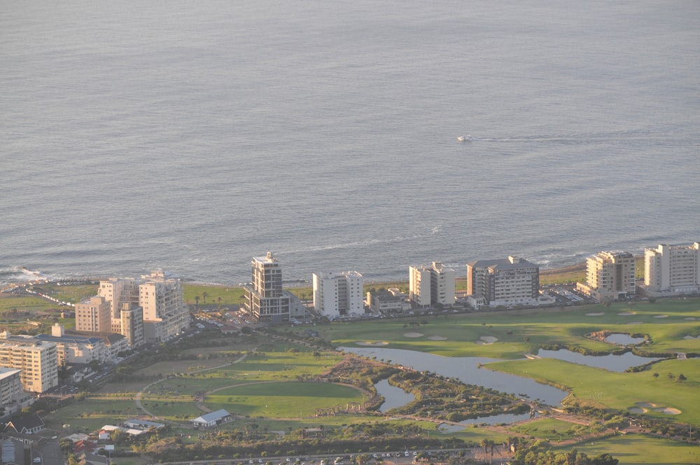 an aerial view of a city by the ocean