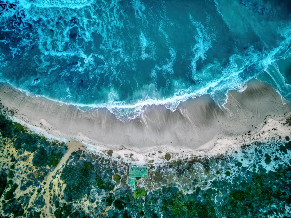 an aerial view of a beach and ocean