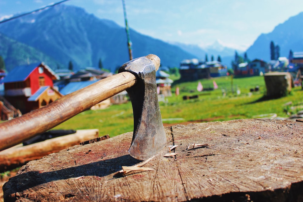 a hammer and an old wooden block of wood