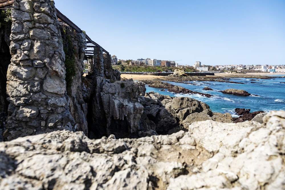 a view of the ocean from a rocky cliff