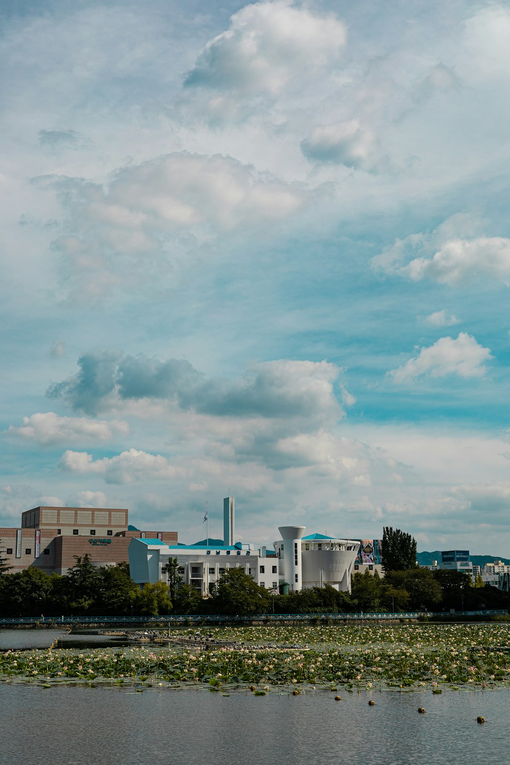 a large body of water with a building in the background