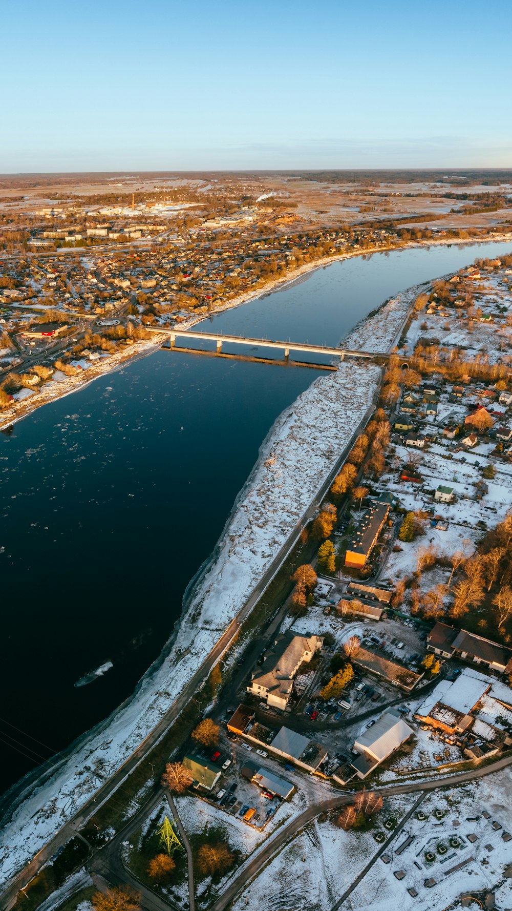 an aerial view of a river and a city