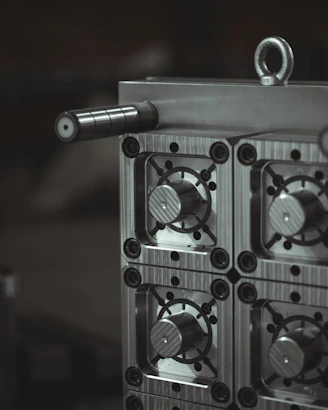 a close up of a metal object with a black and white background