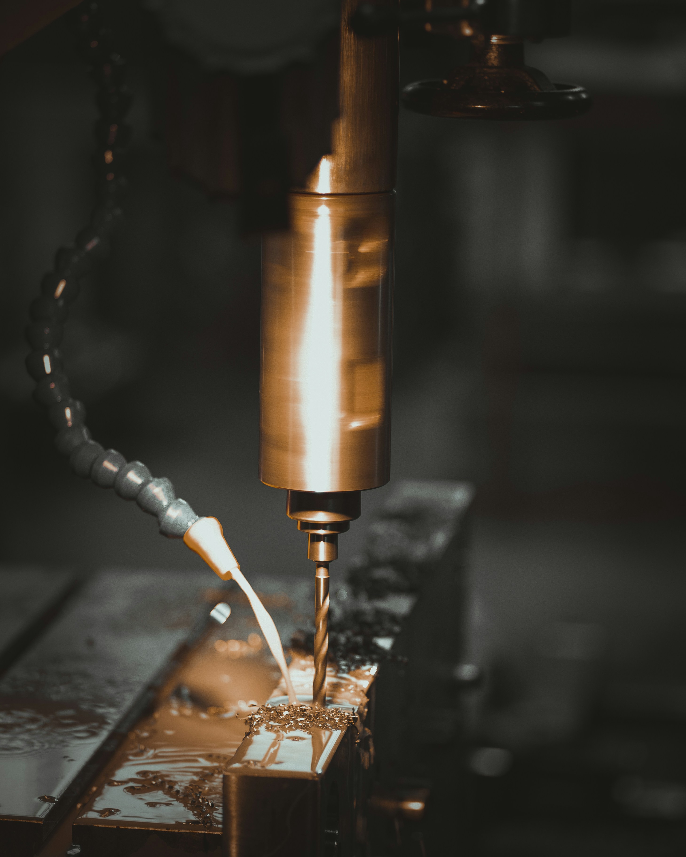a piece of metal being worked on by a machine