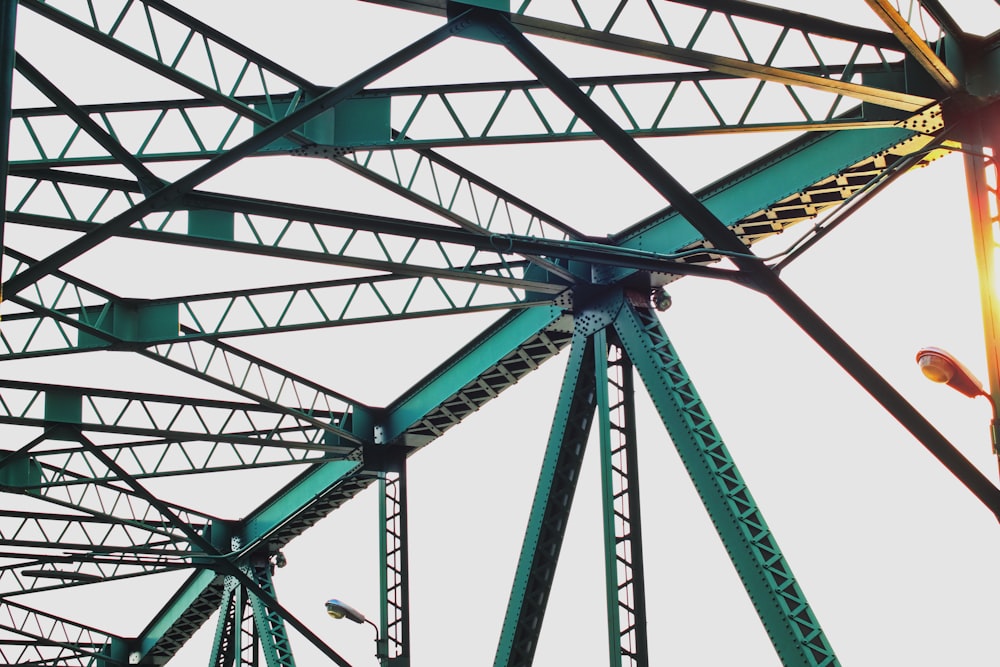 a close up of a metal structure with a sky background