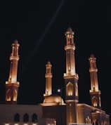 Nighttime shot of Masjid Nabawi illuminated with soft golden lights