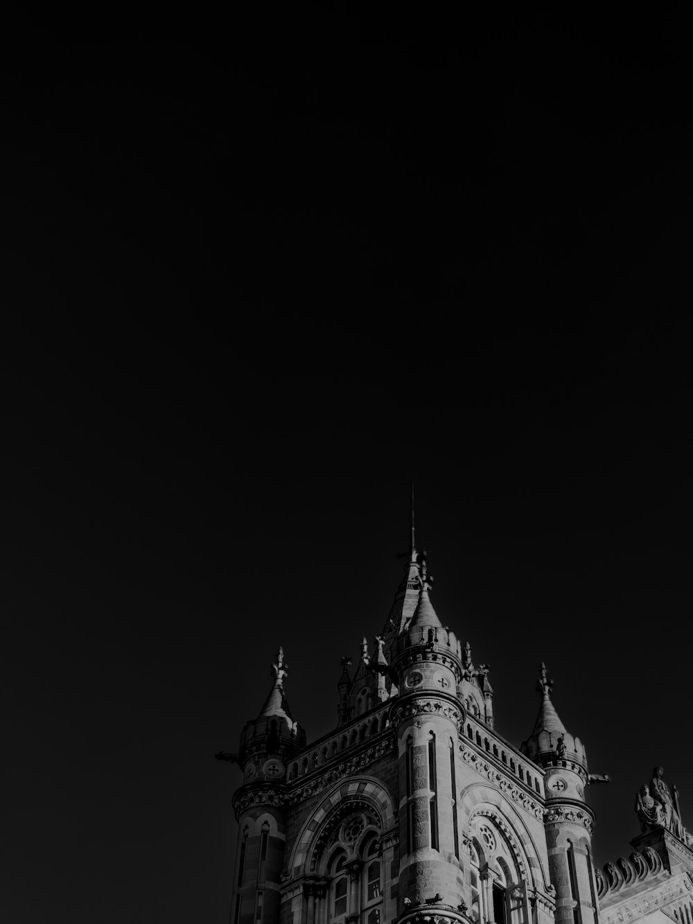 a black and white photo of a clock tower