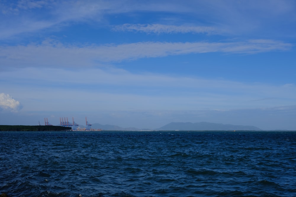 a large body of water with a large ship in the distance