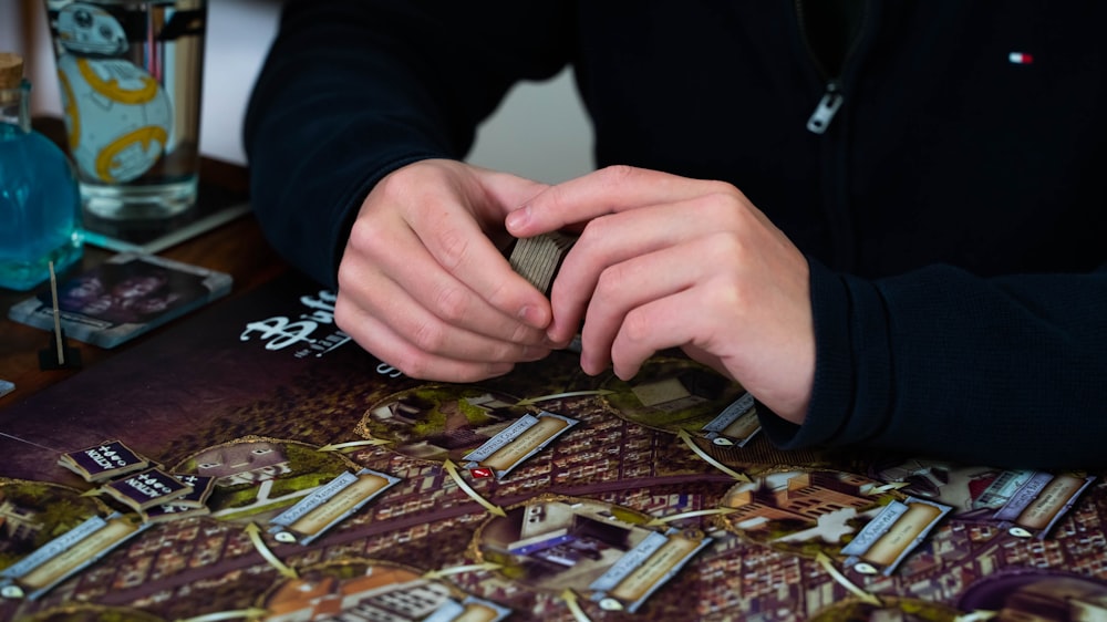 a close up of a person playing with a board game